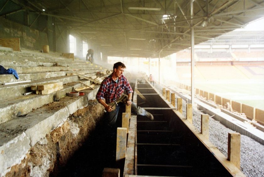 Work being carried out by tradesmen at 'the Shed' in Tannadice Park in 1994.