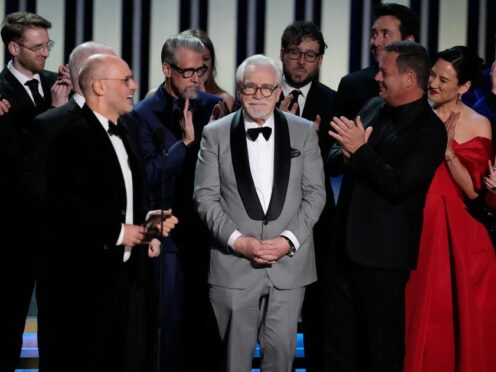 Jesse Armstrong, left, Brian Cox and the team from Succession accept the award for outstanding drama series during the 75th Primetime Emmy Awards (AP Photo/Chris Pizzello)