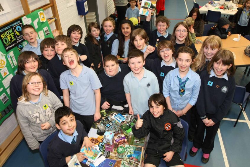 Some of the P6 pupils beside a stall
