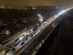 Vehicles were stranded on snow-covered roads in central China (Chinatopix via AP)