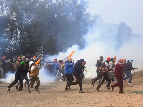 Indian police used tear gas on farmers who clashed with officers and tried to break barricades blocking their way to New Delhi to demand guaranteed crop prices (Rajesh Sachar/AP)