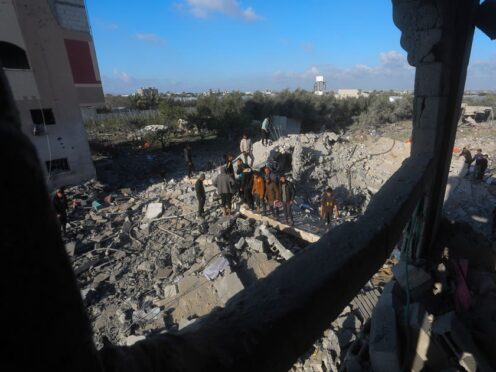 Palestinians search for survivors after an Israeli air strike on a residential building In Rafah (AP/Hatem Ali)