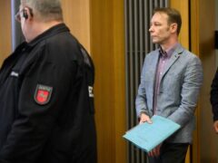 Christian Brueckner arrives at the start of his trial at Braunschweig district court in Germany (Julian Stratenschulte/dpa via AP)