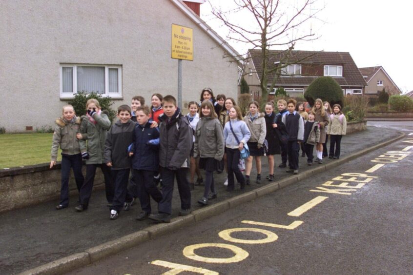 Pupils from Carlogie Primary in a residential street on Walking Wednesday.