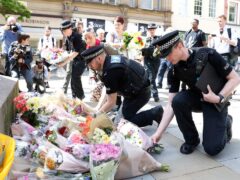 Flowers are left in Manchester in memory of the people who died in the bombing (Martin Rickett/PA)