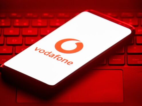 The logo of mobile phone network Vodafone is displayed on the screen of a smartphone.