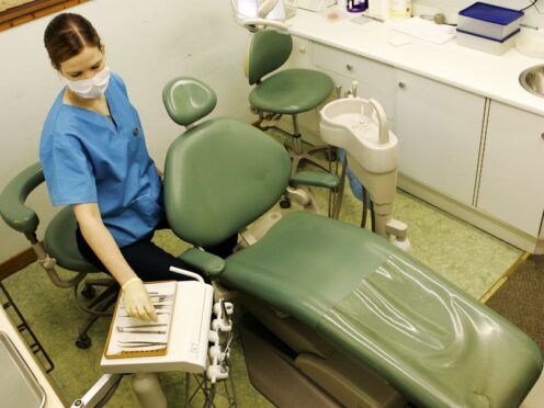 Figures show the number of people seen by an NHS dentist fell by more than a third (Andrew Milligan/PA)
