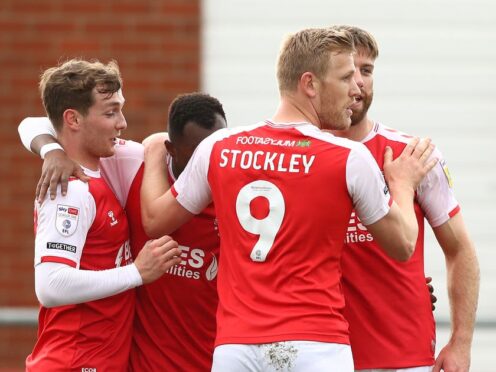 Jayden Stockley (second right) scored two late goals for Fleetwood (Tim Markland/PA)