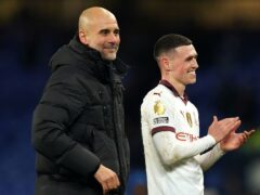 Manchester City manager Pep Guardiola with in-form Phil Foden (Martin Rickett/PA)