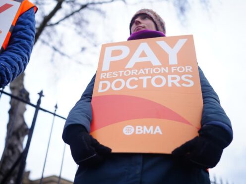 Junior doctors and members of the British Medical Association stand on the picket line outside Cheltenham General Hospital (PA)