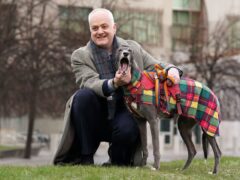 Mark Ruskell was joined by Bluesy the greyhound at Holyrood as he launched a consultation on his proposed ban (Andrew Milligan/PA)