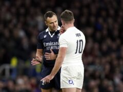 Referee James Doleman explains to George Ford why he allowed Wales to charge down (Andrew Matthews/PA)