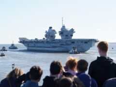 Royal Navy aircraft carrier HMS Prince of Wales sets sail from Portsmouth Harbour following a delay to its departure (Gareth Fuller/PA)
