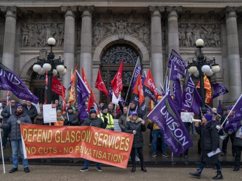 Trade unions, including Unison, GMB, Unite and the EIS, protest against cuts in council jobs and services outside the City Chambers in George Square, Glasgow (Jane Barlow/PA)