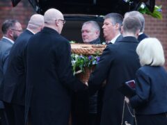 Pall bearers carry the casket of former Rochdale MP Sir Tony Lloyd, at St Hugh Of Lincoln RC Church in Stretford, Greater Manchester (Peter Byrne/PA)