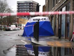A police forensic tent in Shoreditch, east London, near the scene (Victoria Jones/PA)