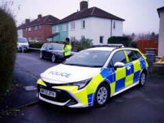 Police at the scene after three children were found dead at a house in Bristol (Ben Birchall/PA)