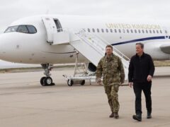 Foreign Secretary Lord David Cameron, right, arrives at Mount Pleasant airbase on the Falkland Islands (Stefan Rousseau/PA)