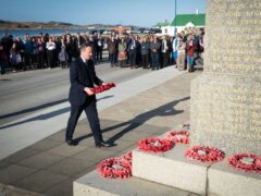 Foreign Secretary Lord David Cameron attends a wreath laying ceremony at the Falklands conflict memorial in Port Stanley on the Falkland Islands (Stefan Rousseau/PA)
