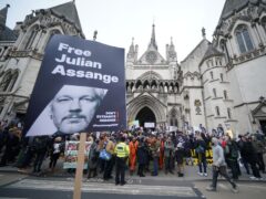 Supporters gathered outside the Royal Courts Of Justice in London, ahead of a two-day hearing in the extradition case of WikiLeaks founder Julian Assange (PA)