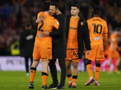 Hull manager Liam Rosenior, centre left, embraces captain Lewie Coyle at full-time (Adam Davy/PA)