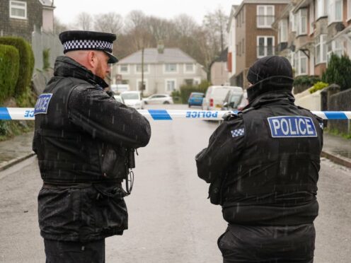 Emergency personnel by the cordon after a suspected Second World War explosive device was discovered in Plymouth (Matt Keeble/PA)