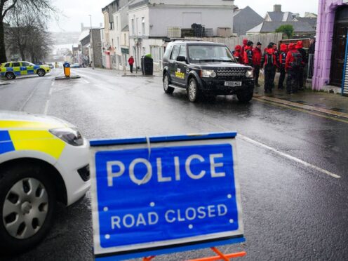 Emergency workers gather in Albert Road near to the Torpoint Ferry crossing in Plymouth, where a suspected Second World War explosive device, discovered in a garden in St Michael Avenue in the Keyham area of Plymouth, will be taken by military convoy to the Torpoint Ferry slipway to be disposed of at sea. Picture date: Friday February 23, 2024.
