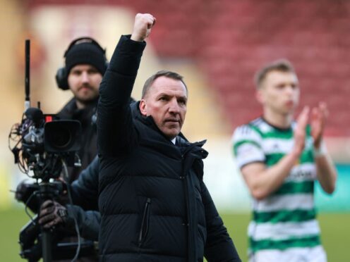 Celtic manager Brendan Rodgers celebrates following a dramatic finale (Steve Welsh/PA)