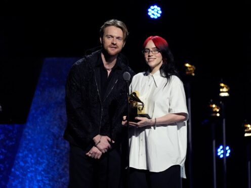 Finneas and Billie Eilish accept the award for best song written for visual media during the 66th annual Grammy Awards on Sunday (Chris Pizzello/AP)