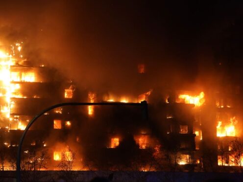 The fire in Valencia spread to another building (Alberto Saiz/AP)
