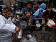 Palestinians try to get food in Rafah (Fatima Shbair/AP)