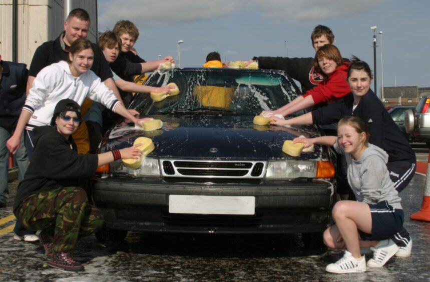 Arbroath Academy pupils gets to work cleaning a car in 2007.