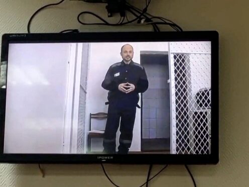 Opposition activist Vladimir Kara-Murza is seen on a TV screen during a video broadcast provided by the Russian Federal Penitentiary Service (Russian independent news outlet Sota telegram channel via AP/PA)