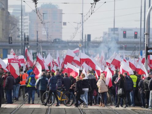 Thousands of Polish farmers, with national flags and angry slogans written on boards, protested against EU green policies (Czarek Sokolowski/AP)