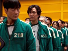 Lee Jung-jae, pictured centrally, stars in Squid Game (Netflix/PA)