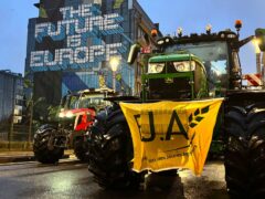 A protest by farmers outside a meeting of EU agriculture ministers in Brussels (Sylvain Plazy/AP)
