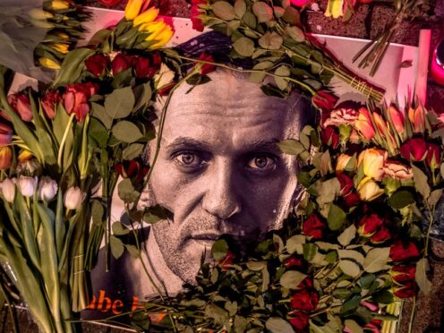Flowers and a photo of Russian opposition leader Alexei Navalny placed near the Russian consulate in Frankfurt, Germany (Michael Probst/AP)