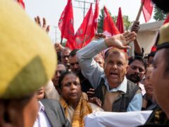 Trade union members and farmers protest at new agriculture laws in Jammu (AP Photo/Channi Anand)