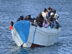People thought to be migrants arrive on a small boat at La Restinga port on the canary island of El Hierro on Sunday (Europa Press via AP)