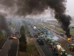 Farmers make barricades after blocking a highway during a protest near Mollerussa, north-east Spain (Emilio Morenatti/AP)