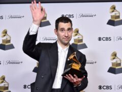 Jack Antonoff poses in the press room with the award for producer of the year, non-classical during the 66th annual Grammy Awards on Sunday (Richard Shotwell/Invision/AP)
