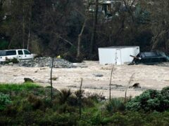 Vehicles were swept away in the floodwater (Watchara Phomicinda/The Orange County Register via AP)