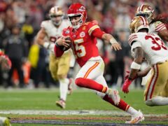 Kansas City Chiefs quarterback Patrick Mahomes (15) scrambles against the San Francisco 49ers during overtime in the NFL Super Bowl (Eric Gay/ AP)