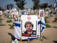 A poster depicting Israeli hostage Alon Ohel is displayed in Re’im, southern Israel, at the Gaza border on Monday (Maya Alleruzzo/AP)