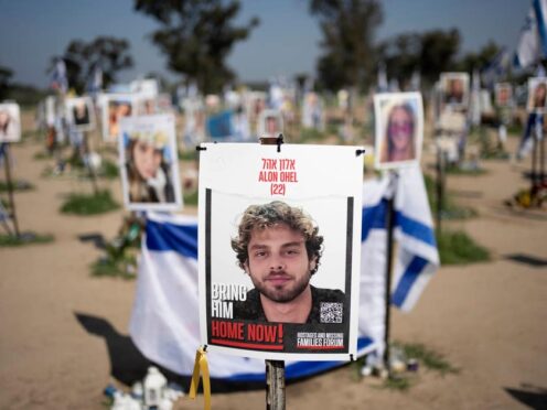 A poster depicting Israeli hostage Alon Ohel is displayed in Re’im, southern Israel at the Gaza border on Monda (Maya Alleruzzo/AP)