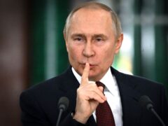 Russian President Vladimir Putin gestures while speaking at a news conference (Sergei Guneyev/AP)