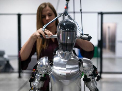 AI engineer Jenna Reher works on a humanoid robot (Jae C Hong/AP)