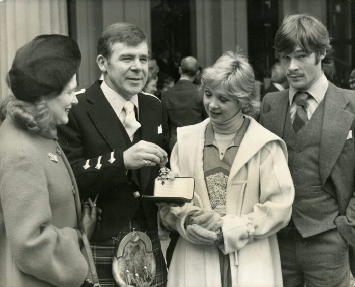 Ewan and sister Tara with Andy and Sheila at Buckingham Palace when Andy received the MBE in 1976.