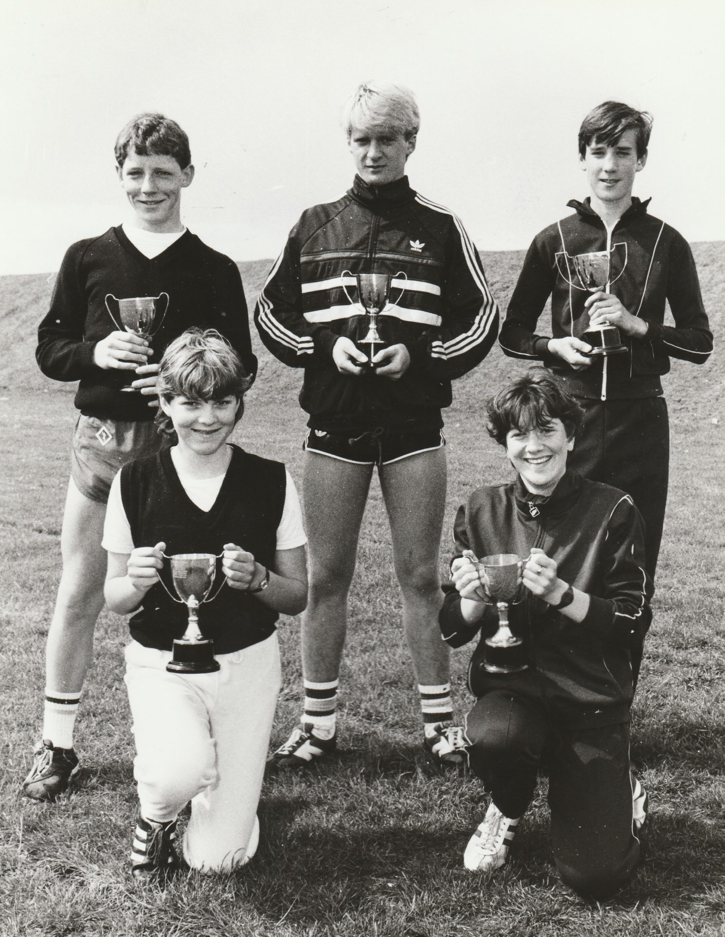 Five Arbroath Academy sports winners with their trophies