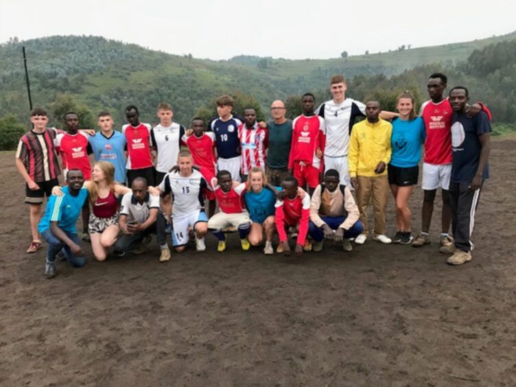 Arbroath Academy pupils and some locals in Rwanda in 2019.